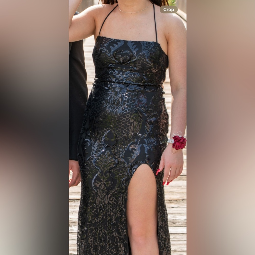 Black sequined prom dress. Medium- stretch fitting material.
